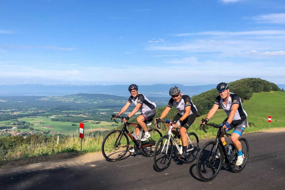 Cycling-Geneva-Lake-View-Three-Cyclists-Raid-Alpine-RFI-TRIP.jpg