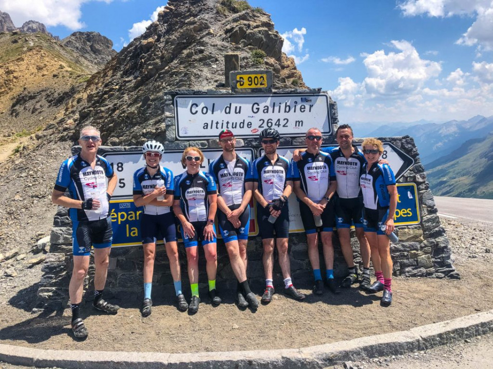 Group of cyclist at Col du Galibier summit on guided short break cycling in Alps with Marmot Tours