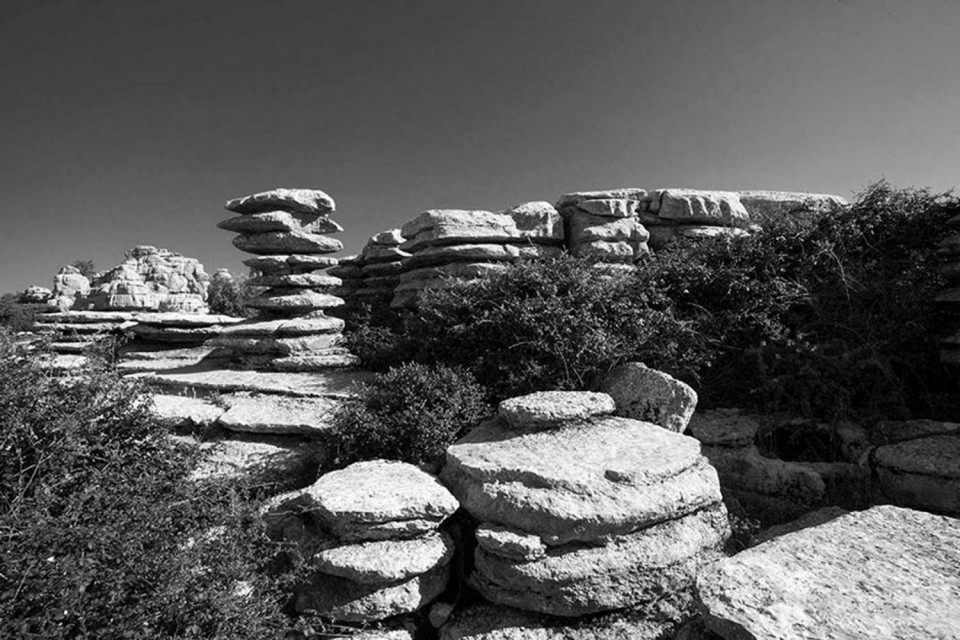 Black and white image of geology of El Torch rock formations on Marmot Tours guided cycling holiday of Andalusia Spain