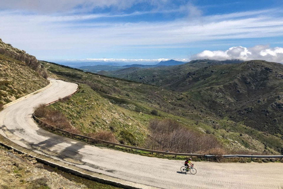 Cyclist enjoying mountainous scenery on full support road cycling holiday in Sardinia with Marmot Tours