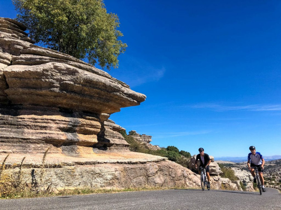Cyclists climbing El Torcal on road cycling holiday Andalusia Spain with Marmot Tours
