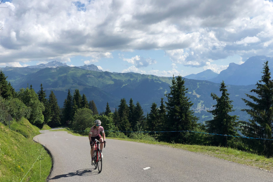 Female cyclist on steep section of Joux Plane on Marmot Tours guided cycling tour Northern French Alps