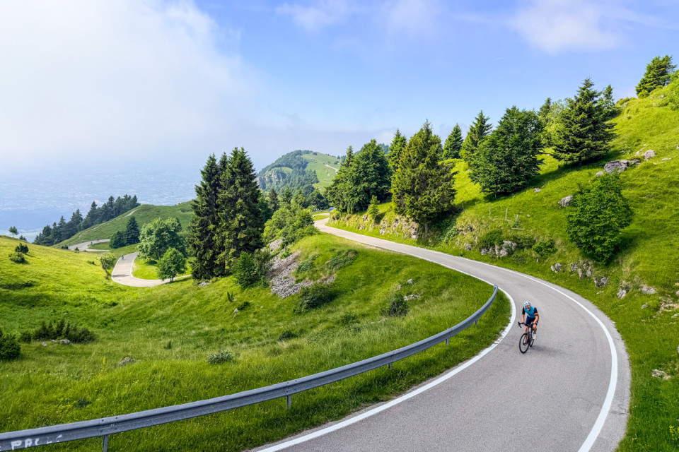 Cyclist climbing monte grappa on marmot tours road cycling holiday