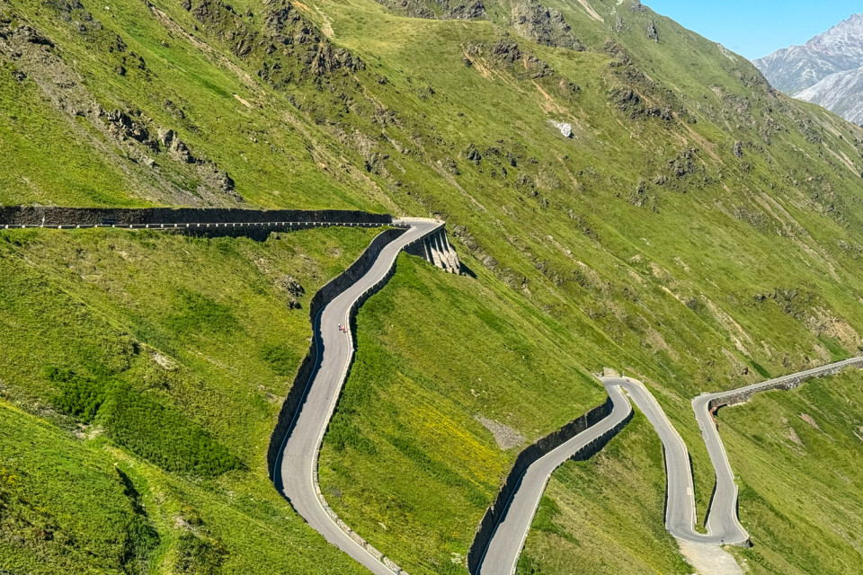 cyclist climbing Passo dello Stelvio from Bormio on marmot tours guided road cycling holiday Italy