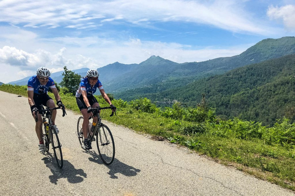 Pair of cyclists enjoy beautiful descent on Raid Corsica with Marmot Tours road cycling holidays