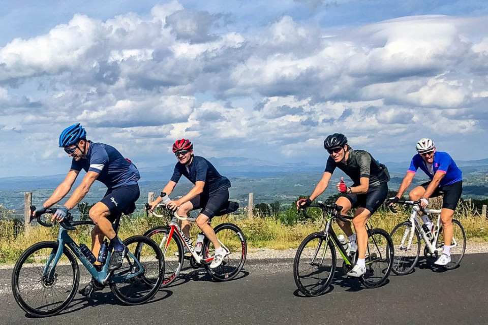 Group of cyclists enjoying the ride on Marmot Tours Raid Massif Central French cycling holiday