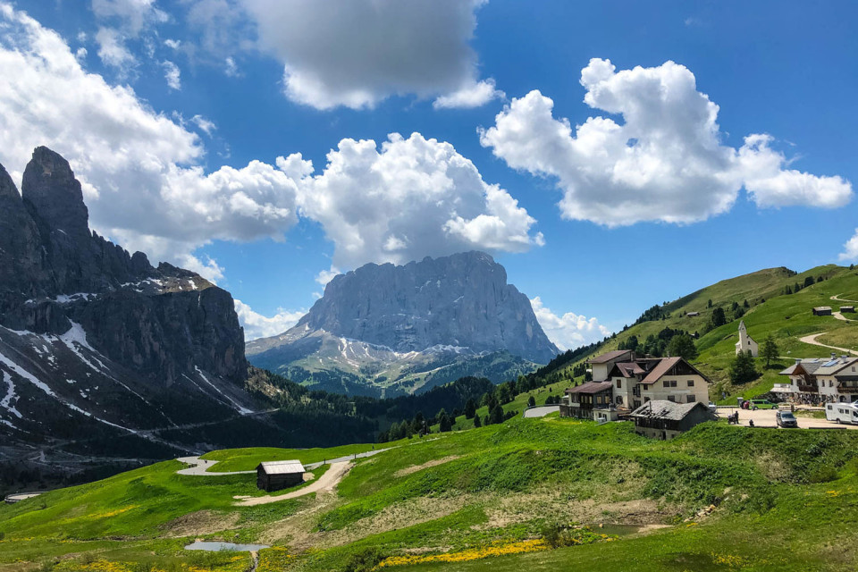 view of dolomites peaks and valley below on marmot tours dolomites cycling mini break