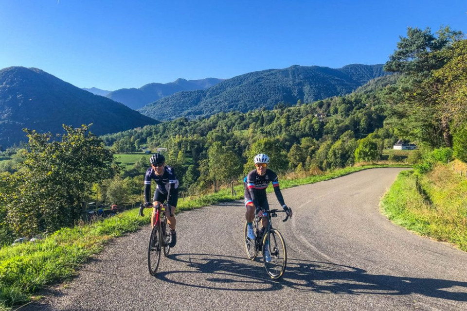 Pair of cyclists enjoying cycling in French Pyrenees on fully support road cycling holiday with Marmot Tours