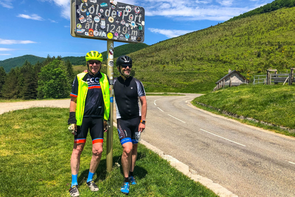 Pair of cyclists smiling at Col de Port on Marmot Tours road cycling holiday Frech Pyrenees