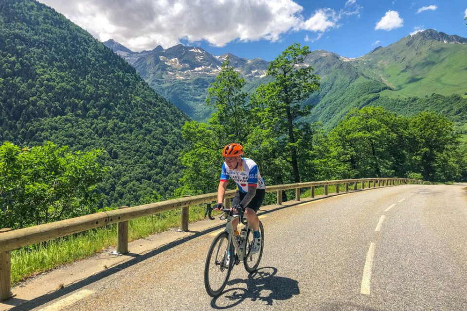 Cyclist climbing in French Pyrenees on guided full support road cycling holiday with Marmot Tours