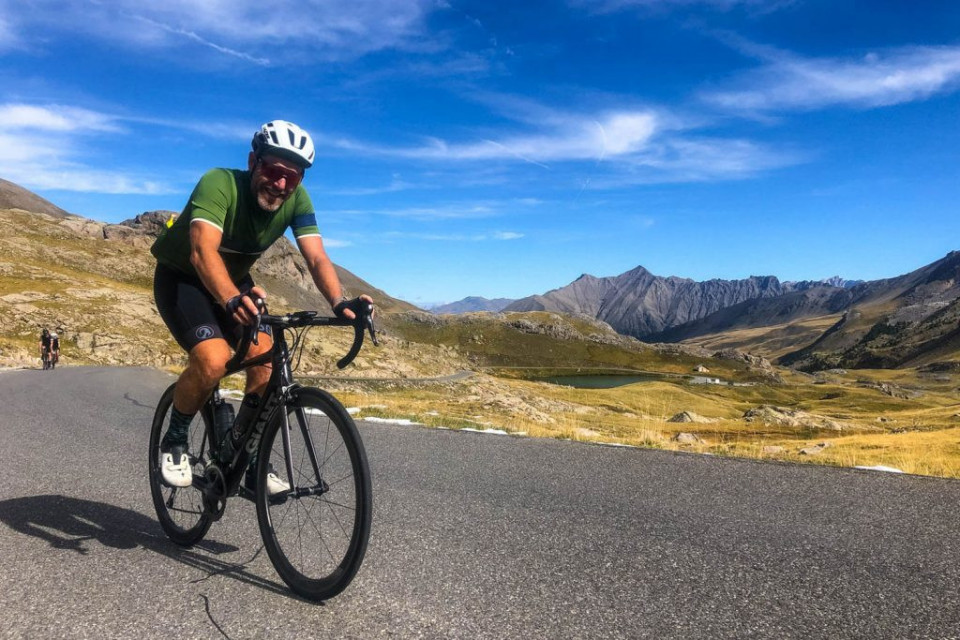 Cyclist climbing Cime de la Bonette on Marmot Tours guided cycling holiday Southern Alps