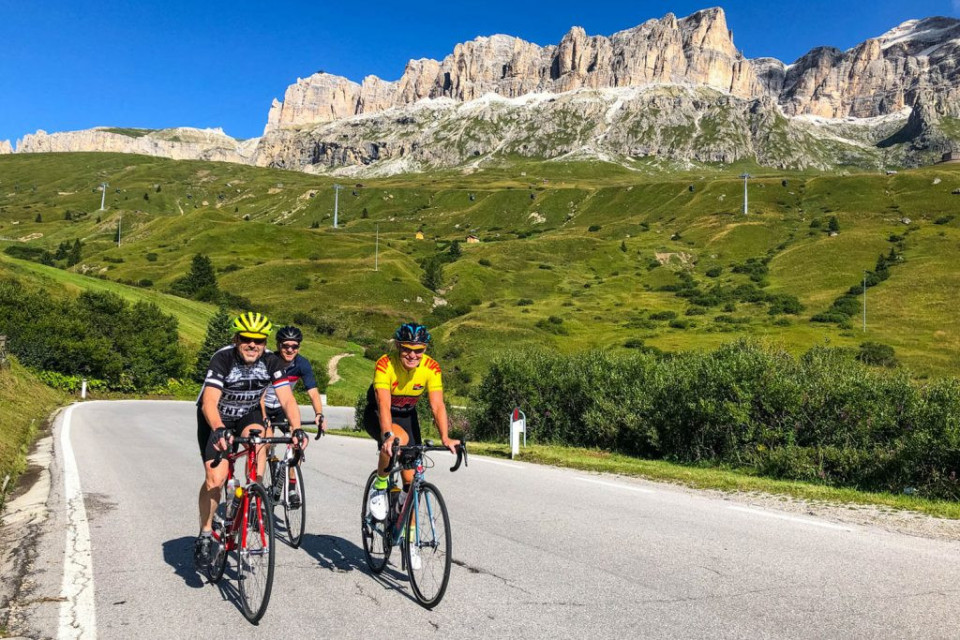 Cyclists enjoying climbing in the Dolomites on Marmot Tours full support cycling tour Italy