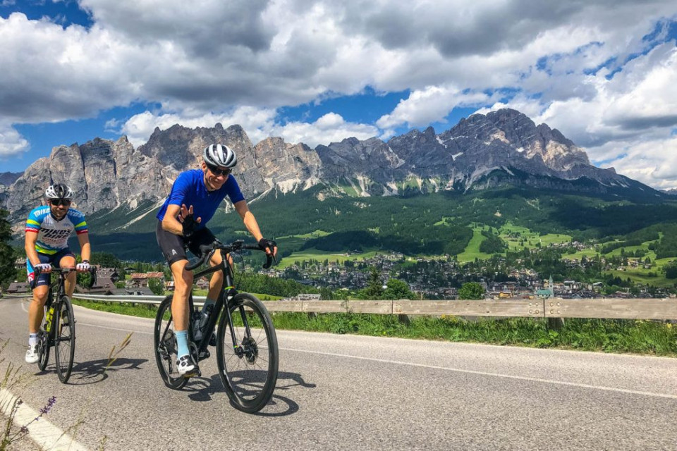 Pair of cyclists enjoying the Dolomites on guided road cycling tour with Marmot Tours