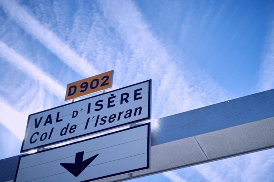 Motorway sign pointing to Val 'Isere Col d'Iseran French Alps on Marmot Tours road cycling tours