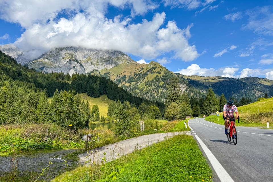 Cyclist climbing mountain pass in Slovenia on marmot tours guided road cycling holiday