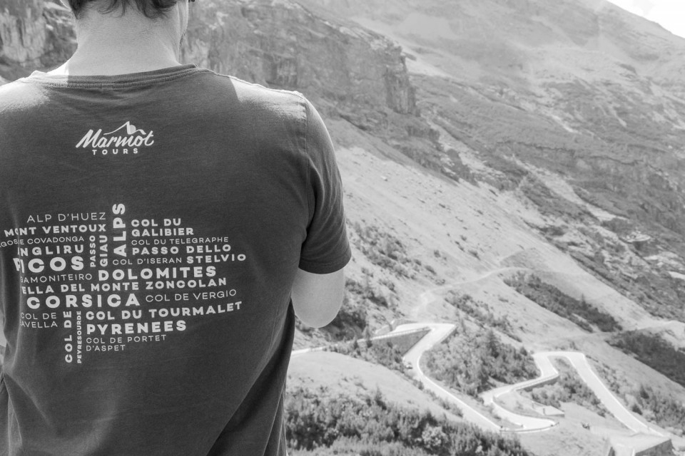 Marmot Tours guide looking down Stelvio valley on Raid Dolomites cycling challenge