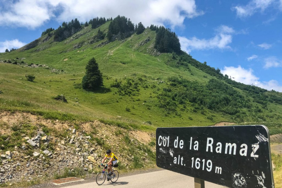Cyclist on Col de la Ramaz on fully supported road cycling holiday in French Alps with Marmot Tours