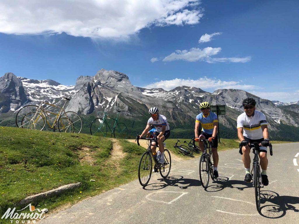 Three cyclists Col d'Aubisque Raid Pyrenean cycling challenge Marmot Tours