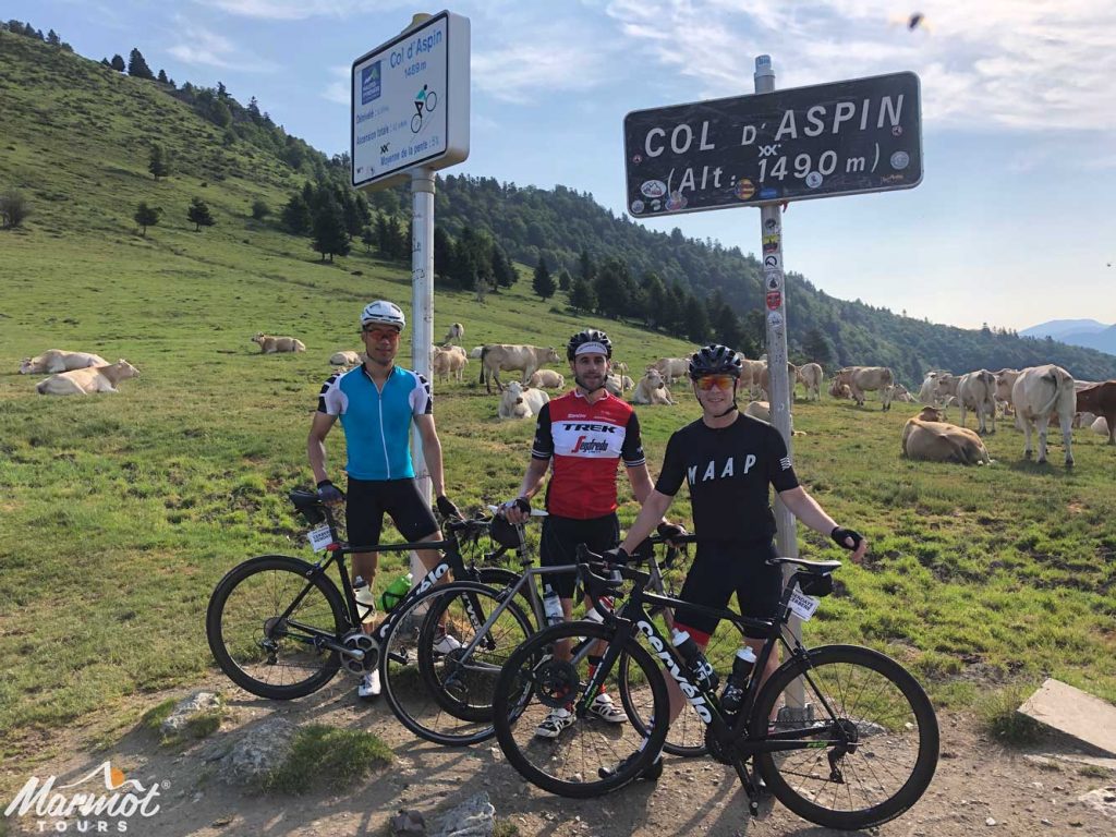 Three cyclists at Col D'Aspin Raid Pyrenees cycling challenge Marmot Tours