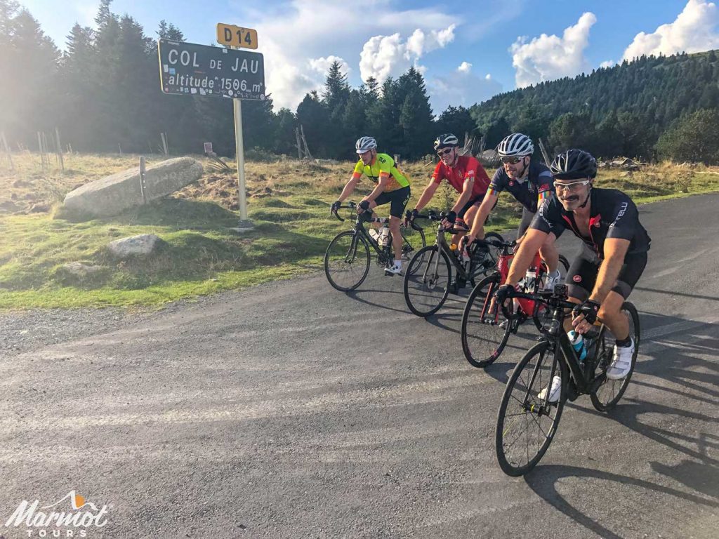 Four cyclists on Col de Jau Raid Pyrenean cycling challenge Marmot Tours