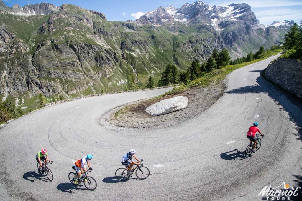 Cyclists enjoying switchback with Marmot Tours French Alps road cycling holiday