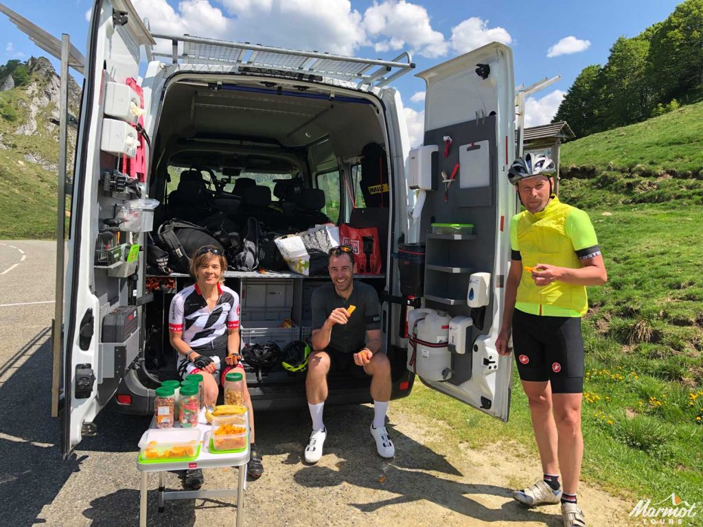 Marmot Tours van interior and clients on a road cycling holiday in Europe