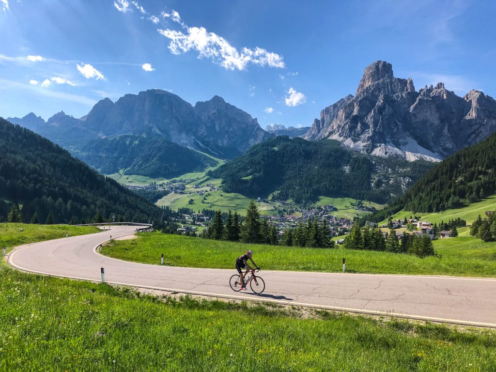 Cyclist with beautiful backdrop of Italian Dolomites on Marmot Tours European road cycling holidays in Italy