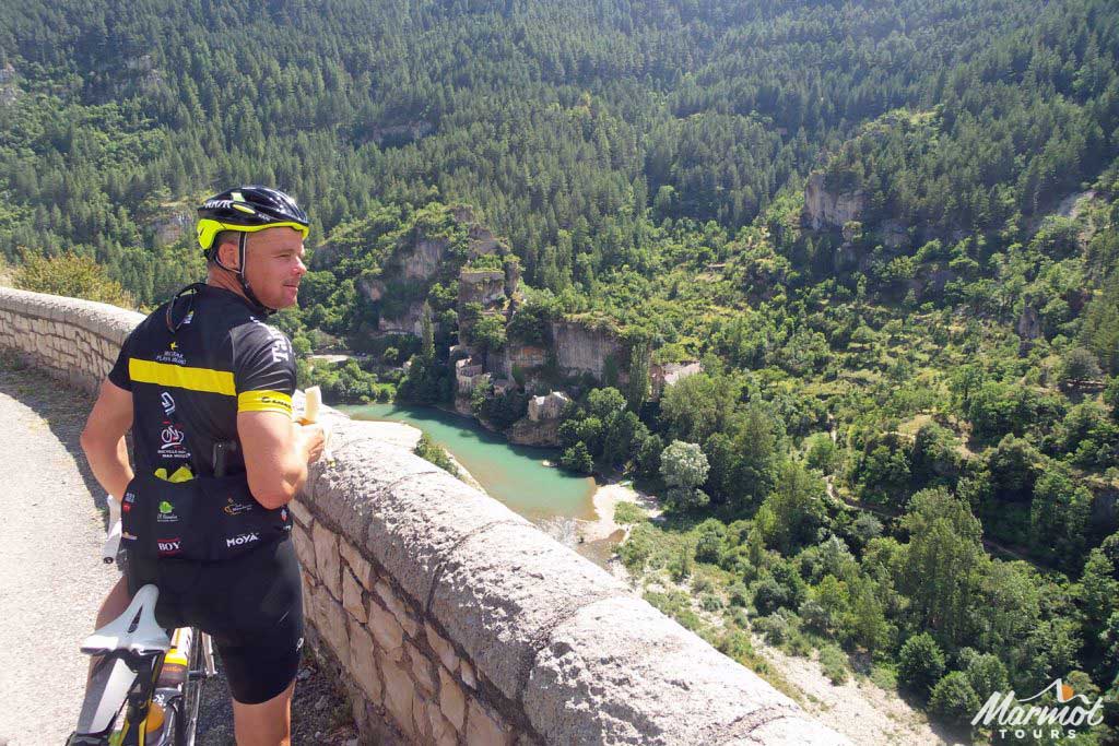 Cyclist overlooking gorge on Marmot Tours French cycling holiday in the Cevennes and Ardeche