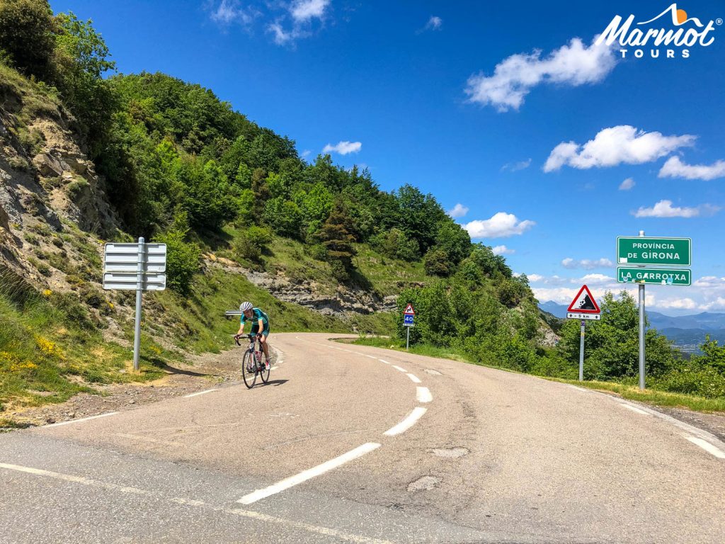 Cyclist descending on guided Girona cycling holiday with Marmot Tours