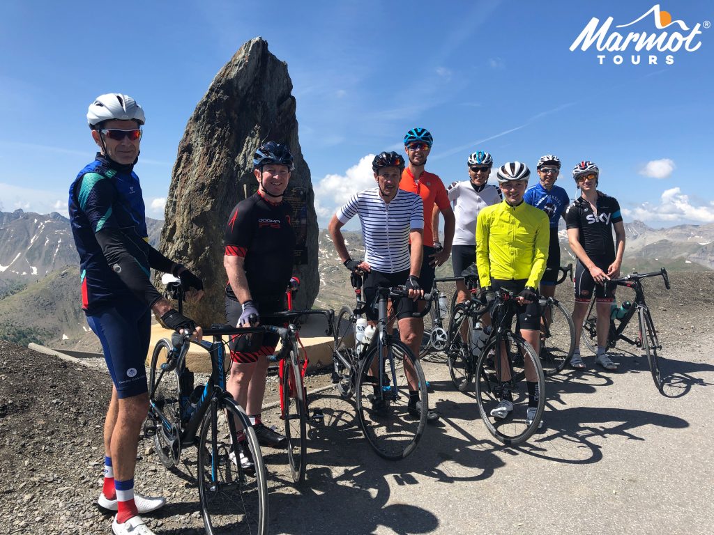 Group of cyclist at the Cime de la Bonette on Marmot Tours guided Raid Alpine cycling challenge