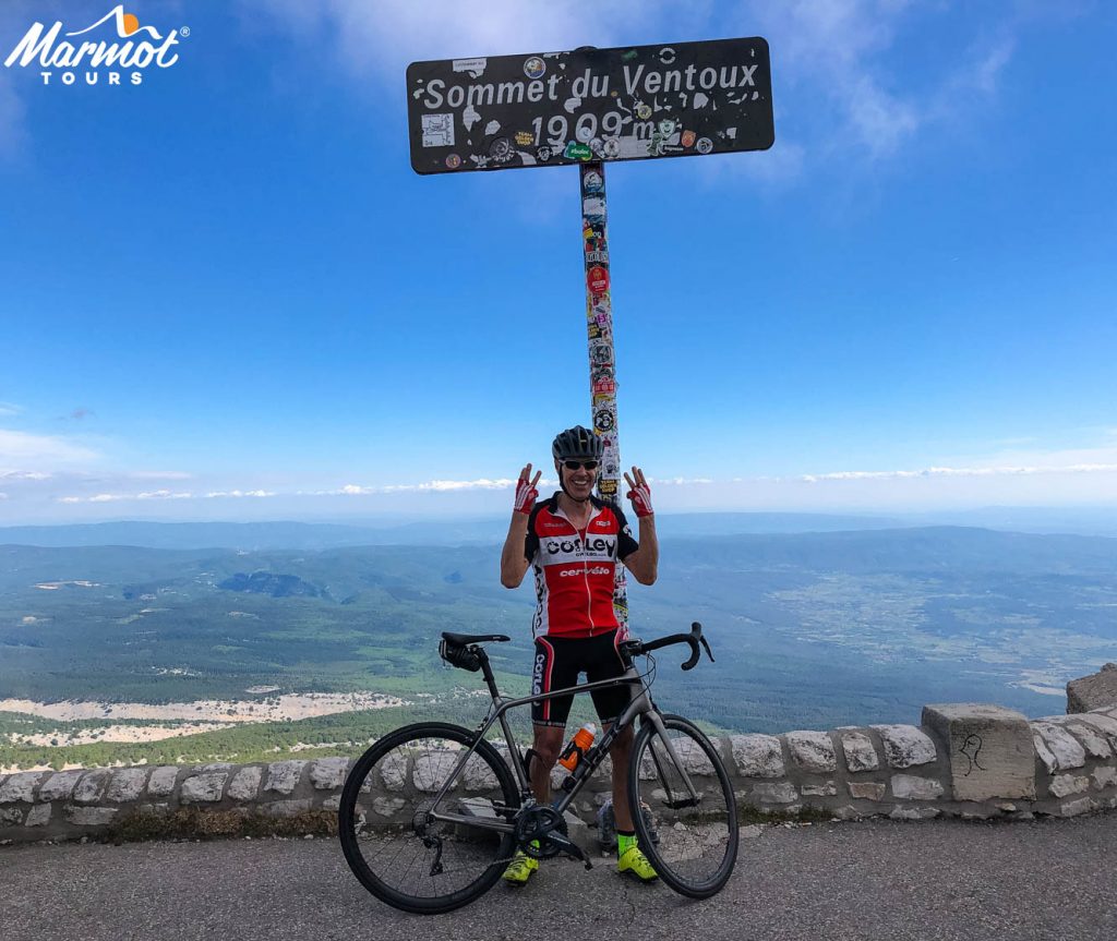 Cyclist on summit of Mont Ventoux with Marmot Tours fully supported Ventoux Club des Cingles Challenge