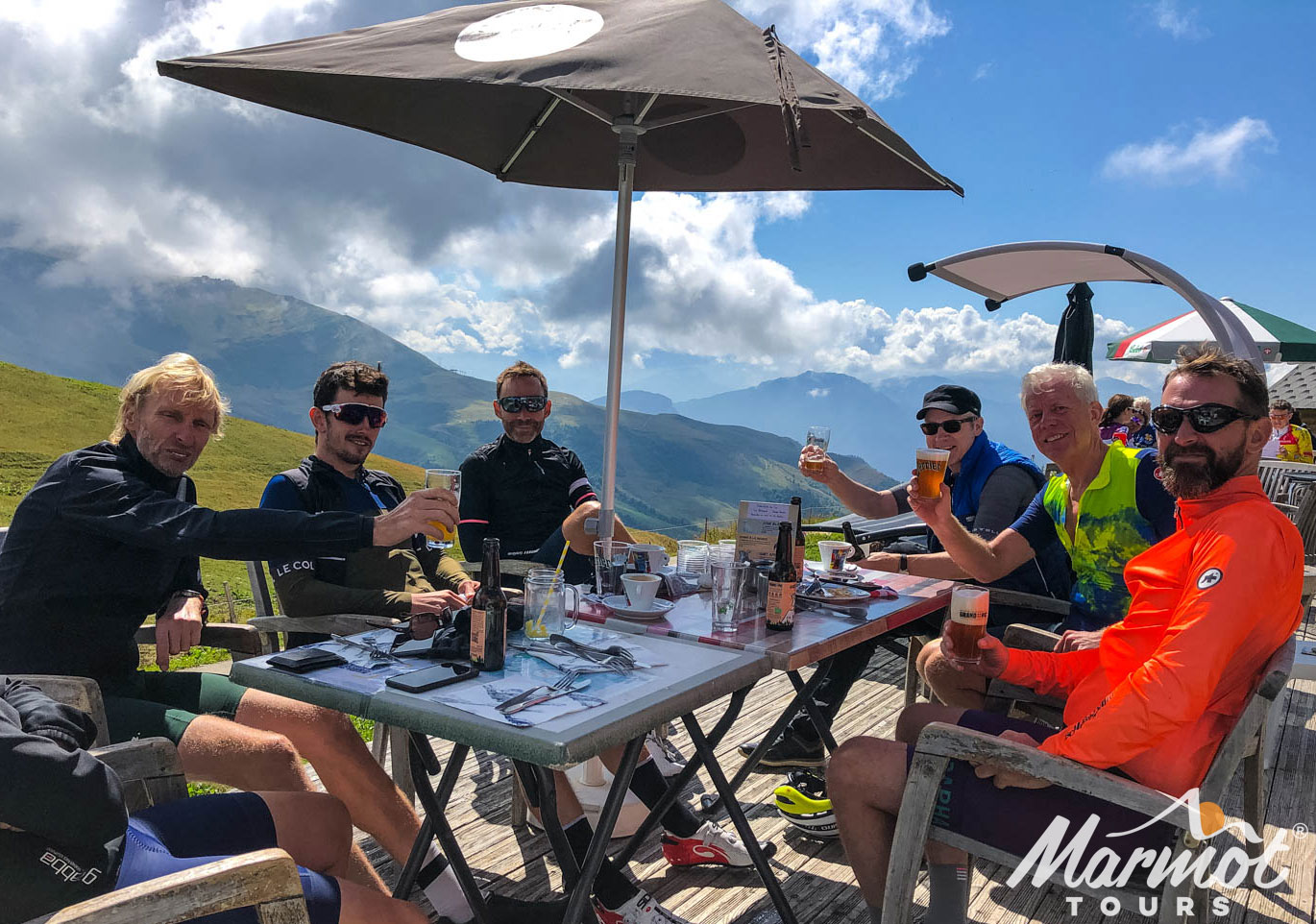 Cyclist-enjoying-beers-in-mountain-bar-on-Marmot-Tours-cycling-holiday-in-the-Alps