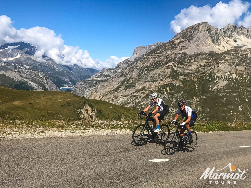Two cyclists climbing col d'Iseran on cycling holiday in the Alps with Marmot Tours