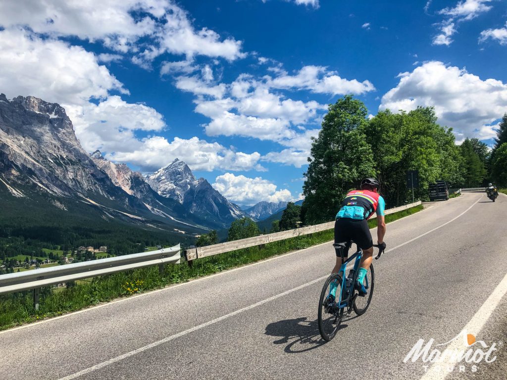 Cyclist climbing in the Italian Dolomites on Marmot Tours road cycling holiday