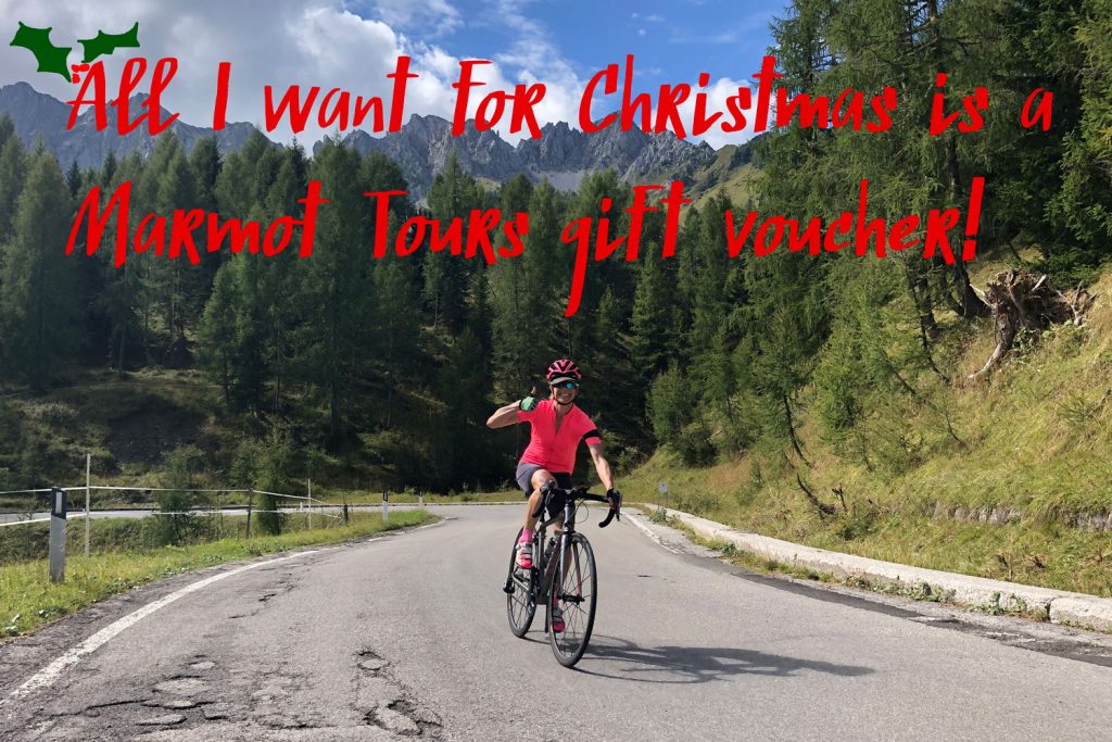 Cyclist with thumbs up on guided road cycling holiday gift voucher from Marmot Tours