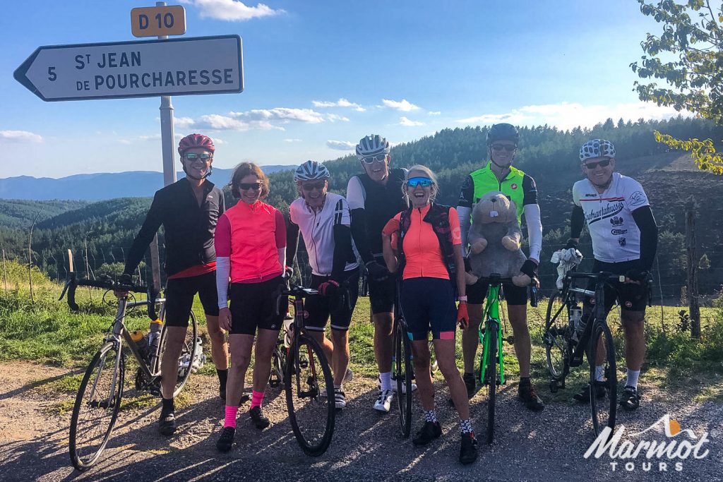 Group of smiling cyclists on Marmot Tours fully supported road cycling tour of Cevennes and Ardeche on South of France cycling holiday
