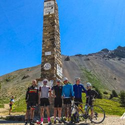 Cyclists at Col d'izzard on Raid Alpine Marmot Tours road cycling challenges