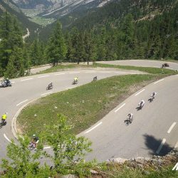 Cyclists descending Col d'izzard on Marmot Tours Raid Alpine cycling challenge
