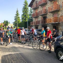 Cyclists outside typical Alpine chalet hotel on Raid Alpine Marmot Tours European road cycling holidays