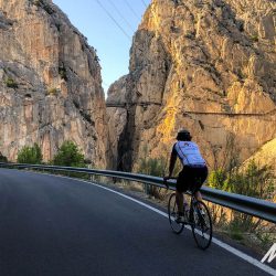 Cyclist and Caminito del Rey on Marmot Tours guided group cycling holiday Andalusia Spain