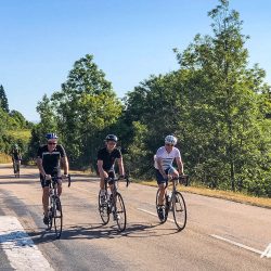 Cyclists enjoying quiet roads of rural France on Marmot Tours Raid Massif Central French cycling holidays