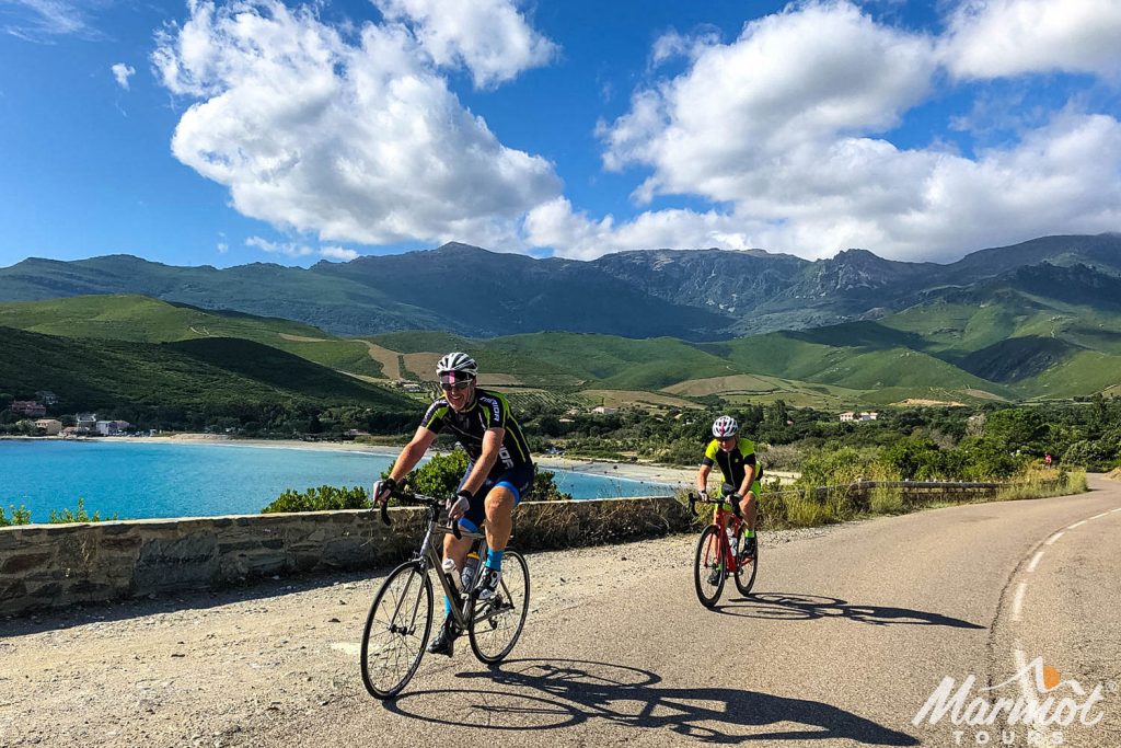 Pair of cyclist enjoying coast road cycling on Sardinia with Marmot Tours guided road cycling holidays