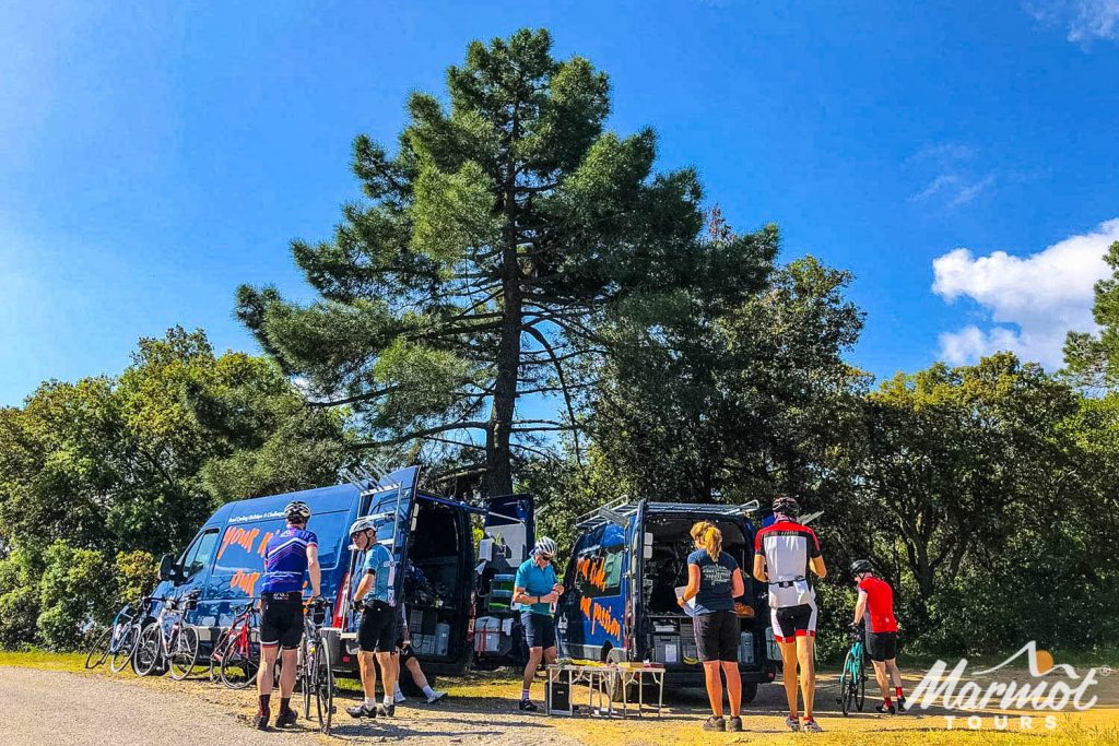 Cyclists and two Marmot Tours support vehicles on guided European cycling tour