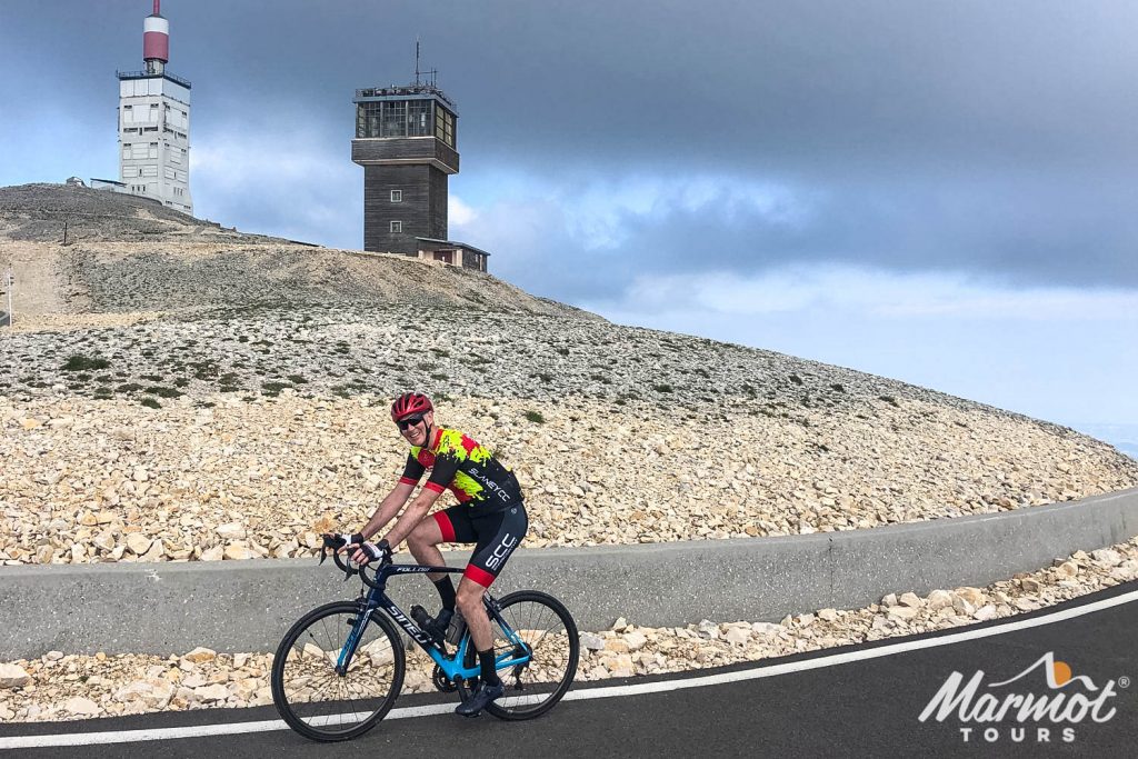 Smiling cyclist near summit of Mont Ventoux on Cingles Challenge with Marmot Tours full support road cycling holiday