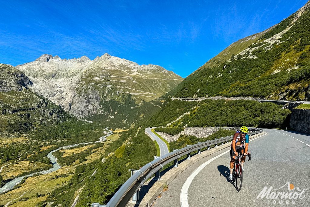 Cyclist climbing Grimsel Pass Swiss Alps with Marmot Tours guided road cycling holidays