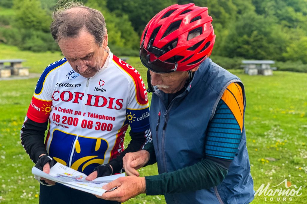 Pair of cyclists Reading route guidance on Marmot Tours full support European cycling holiday