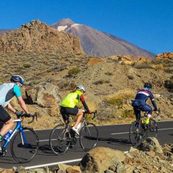 Group of cyclists and Mount Teide on Marmot Tours guided road cycling holiday Tenerife