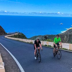 Pair of cyclist on coastal road climb on guided road cycling tour of Tenerife with Marmot Tours