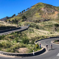 Pair of cyclists climb switchback on Gran Canaria full support cycling holiday with Marmot Tours