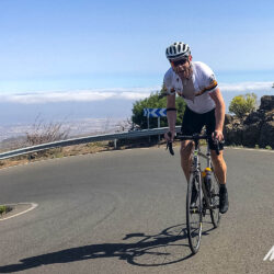 Cyclist pokes out tongue on tough climb in Gran Canaria with Marmot Tours full support road cycling holidays